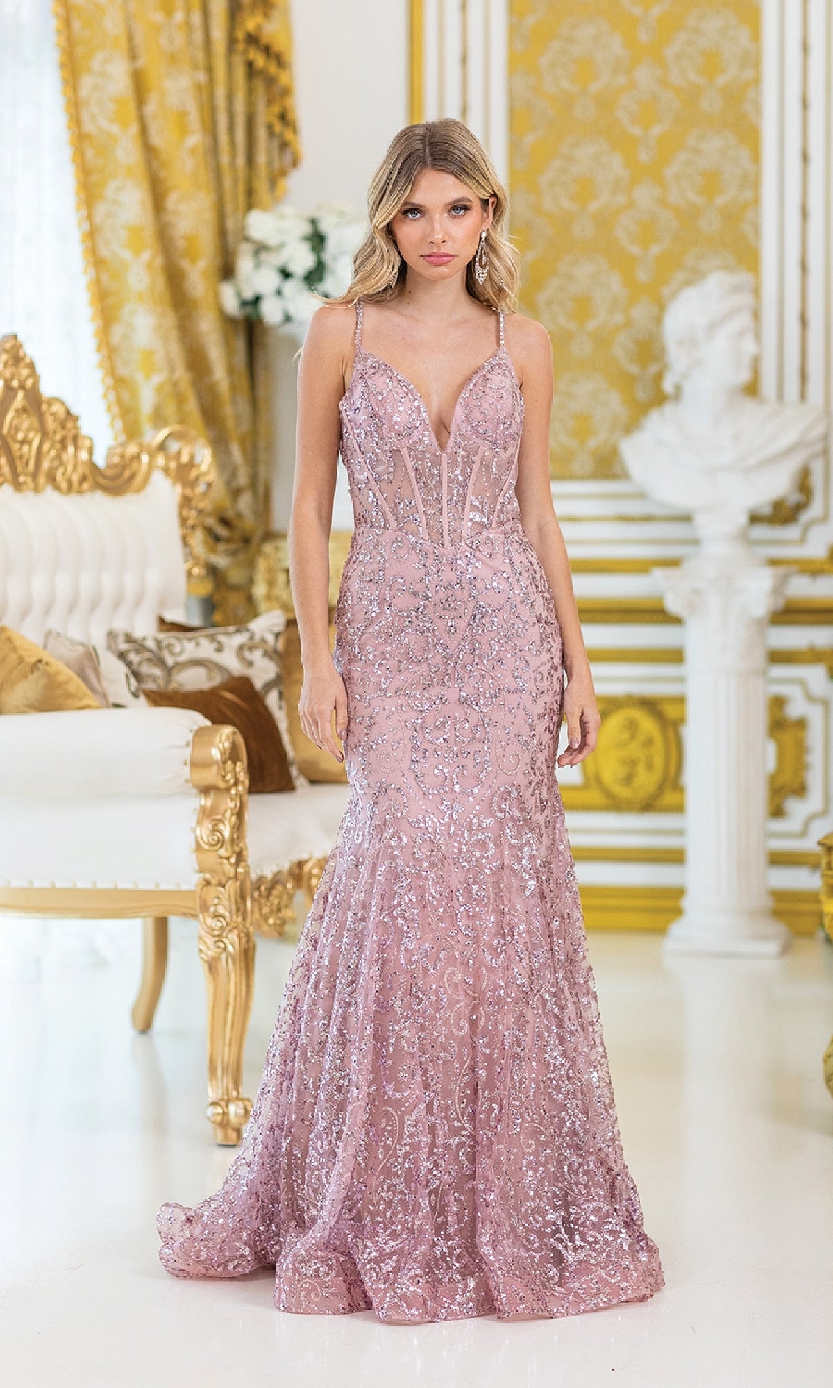 A woman in the Dancing Queen 4464 Strappy Long Beaded Prom Dress stands in an ornate gold and white room.